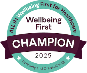 Circle logo that states "All in wellbeing first for healthcare" , " Licensing and credentialing". In the center of circle it says, "Wellbeing first Champion 2025". 