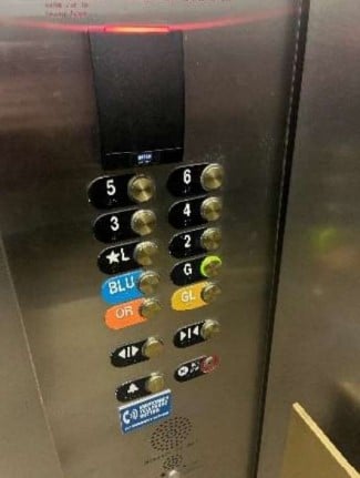 Elevator buttons labeled one to 6 and garage level color coded buttons. 