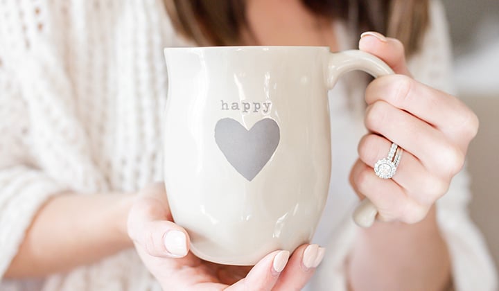 woman holding coffee mug