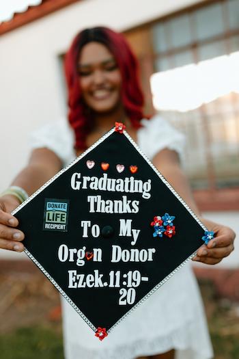 Lanayah's grad cap acknowledging she's here because of her heart transplant