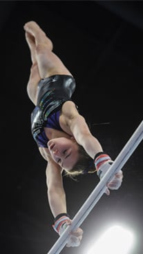 Broken knuckle patient, Ashton, upside down on uneven bars